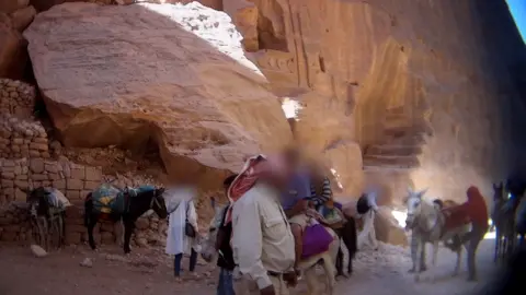 Peta Asia Tourists riding donkeys at Petra, Jordan