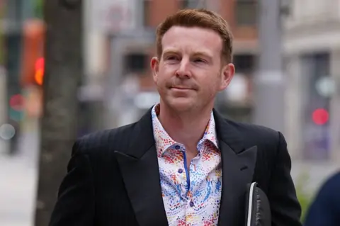 PA Media Alex Belfield outside Nottingham Crown Court on 5 August