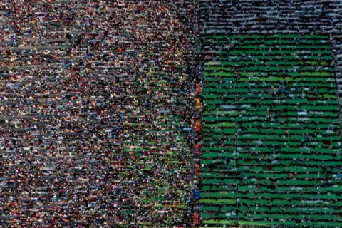 Florion Goga / Reuters Prayers at Skanderbeg Square in Tirana, Albani