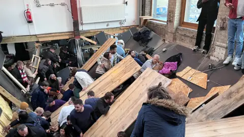 People after the mezzanine floor collapsed