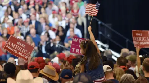Getty Images Supporters cheer as US President Donald Trump speaks at a Make America Great Again rally in Phoenix, Arizona