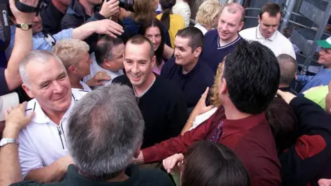 PA Media IRA prisoners on early release emerge through the Maze Prison turnstile in 2000