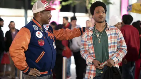 Amazon Studios The moment Akeem sets eyes on his son Lavelle (played by Jermaine Fowler)