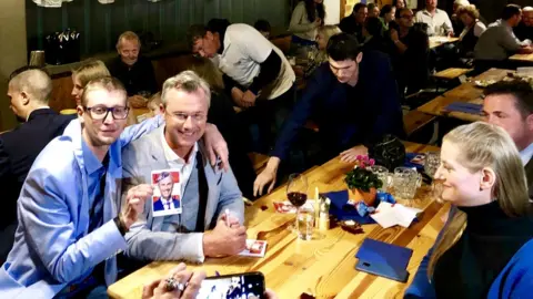 Norbert Hofer (R) with a supporter at a campaign barbecue