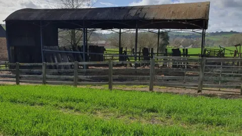 Image of the burnt out barn in Wiveliscombe