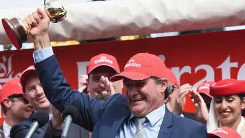 Getty Images Darren Weir holding the Melbourne Cup trophy after his win in 2015