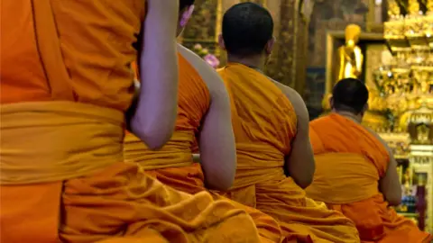 Getty Images Buddhist monks praying