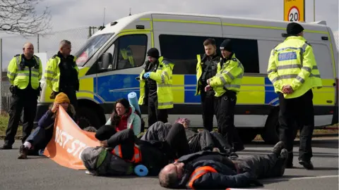 PA Media Activists from Just Stop Oil take part in a blockade at the Kingsbury Oil Terminal, Warwickshire