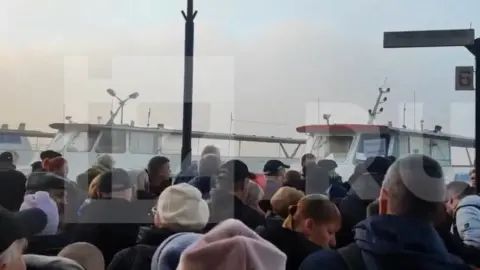 Izvestia Russia's Izvestia website showed footage of people gathering to cross the Dnieper river by ferry out of Kherson