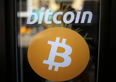 Reuters Bitcoin logo on shop window