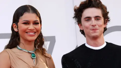 Getty Images Dune stars Zendaya and Timothée Chalamet posed for pictures on the red carpet at Venice International Film Festival on Friday