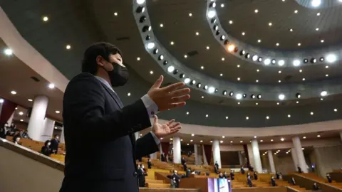 Getty Images Pastors wear mask as they pray during a Easter worship as South Koreans take measures to protect themselves against the spread of coronavirus (COVID-19) at the Yoido Full Gospel Church