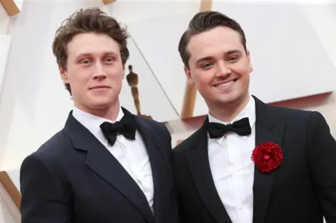 Shutterstock George MacKay and Dean-Charles Chapman on the red carpet