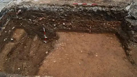 Civic A trench shows several different levels of road