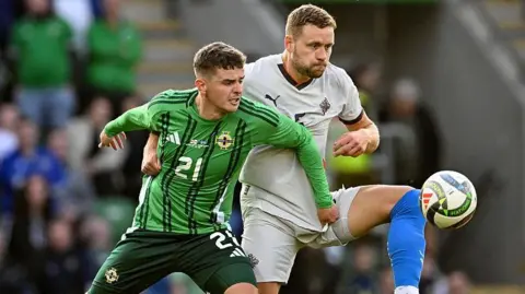 Northern Ireland's Ronan Hale and Iceland's Sverrir Ingi Ingason competing for the ball during an international friendly.