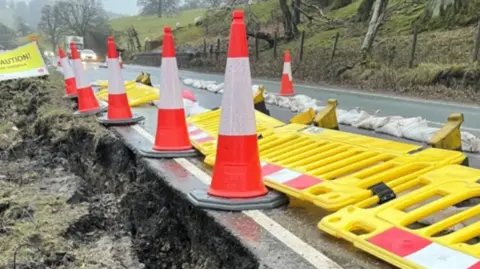 North Yorkshire Council A section of the A59 coned off with a hole at the side of the road.