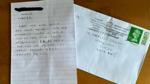 Claire Wright The hand-written letter and the stamped envelope it came in 