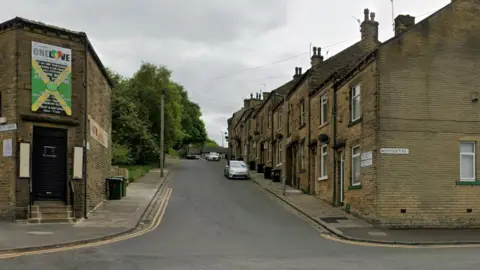 Terraced houses running up a hill.