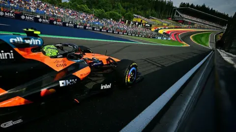 Lando Norris approaches Eau Rouge 