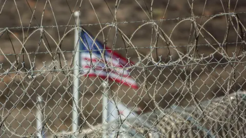 Getty Images Barbed wire and American flag