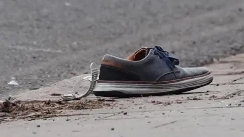 Jacob King/PA Wire Watch and shoe