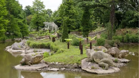 GERARD PUIGMAL/GETTY IMAGES Image showing dinosaur sculptures in Crystal Palace Park