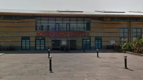 The entrance to the Sovereign Centre in Eastbourne - a cream building with Sovereign Centre 