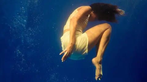 Swimmers - A female figure underwater