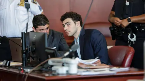 Luigi Mangione speaks with his lawyer during a court hearing in New York on 18 May 2026.