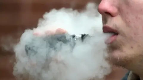 PA Media A man vaping