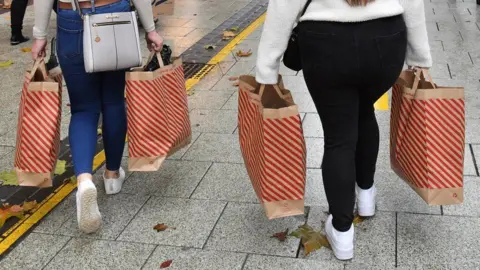 Ben Birchall/PA Wire shoppers