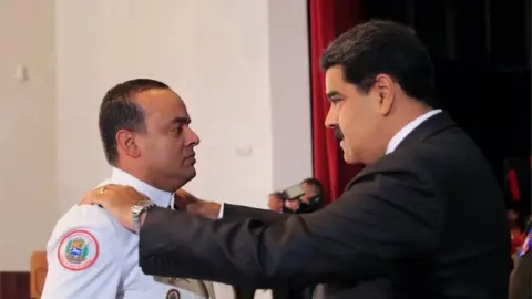 Reuters Venezuela's President Nicolas Maduro changes the epaulette of a soldier during a promotion ceremony in Caracas, Venezuela July 2, 2018.