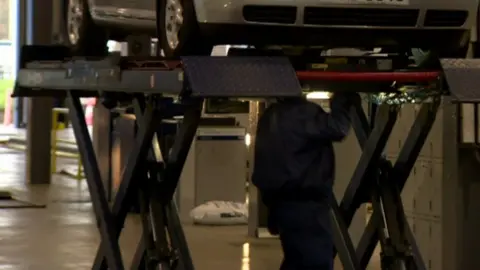 Scissor lifts are used in MOT centres to inspect underneath vehicles