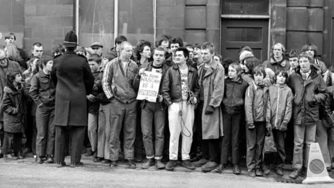 Alamy Crowds outside Dewsbury Magistrates' Court