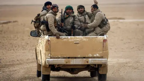 AFP File photo shows members of the Syrian Democratic Forces (SDF) in vehicle north of Raqqa (8 February 2017)