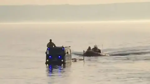 Wirral Coastguard Rescue Team RNLI rescue walkers off coast of Wirral