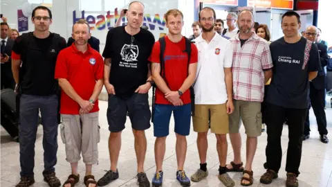 REUTERS/Henry Nicholls Divers returning home
