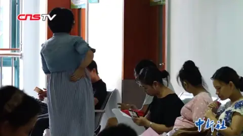 CNS Pregnant women in a hospital waiting room in Wuhan