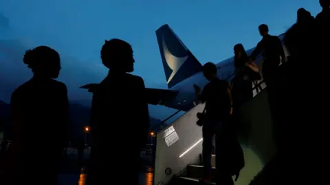 Reuters Guests descend from a Cathay Pacific Airways Airbus A350 after a tour of the aircraft cabin at Hong Kong Airport May 30, 2016.