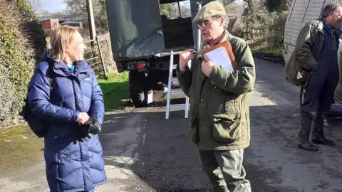 Nick Barclay Shropshire MP Helen Morgan with a Pentre resident