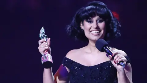 Singer-songwriter Raye speaking after winning another Brit Award.