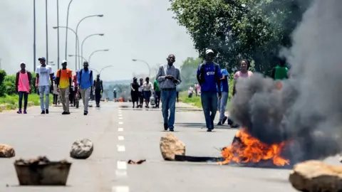 Getty Images Burning barricade during a demonstration on January 14, 2019 in Bulawayo