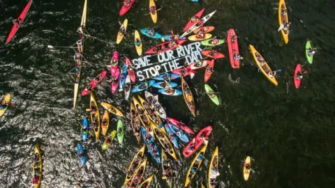 Matic Oblak Aerial photo of kayakers protesting the dam