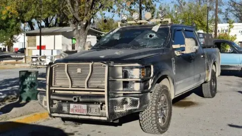 Reuters A bullet-riddled pick-up truck is pictured after clashes sparked by suspected cartel gunmen in a northern Mexican town that killed 20 people this weekend, in Villa Union, Coahuila state