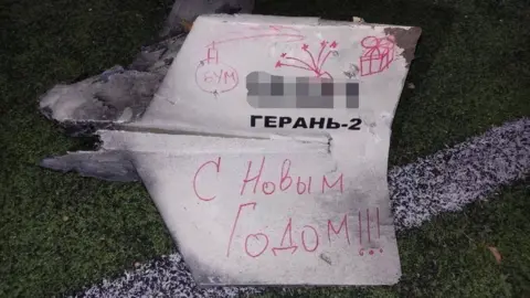 Kyiv Police A downed drone found in a children's playground in Kyiv with the words 'Happy New Year' written in Russian on it