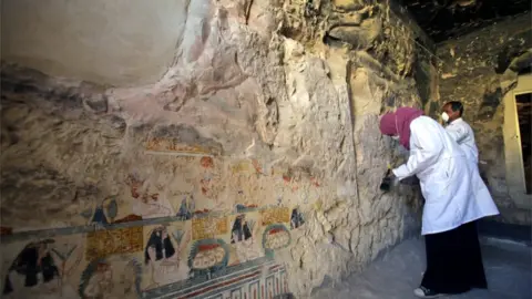 EPA Sarcophagi and mummies discovered at Luxor site