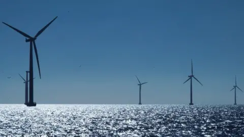Reuters Five wind turbines in an offshore wind farm