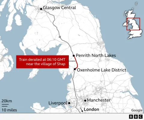 A map which is focused on the south of Scotland and the north of England. There is a line running from Glasgow Central in the top left, down the west coast towards London, signposting Liverpool and Manchester on either side at the bottom. Above that, Penrith North Lakes and Oxenholme Lake District stations are highlighted, with the line between them in red. There is a red box to the side with reads: "Train derailed at 06:10 GMT near the village of Shap."
