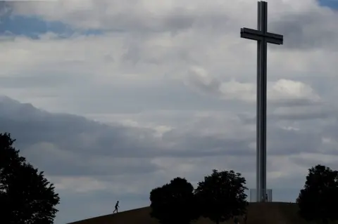 PA A person walks towards the Papal Cross in Dublin