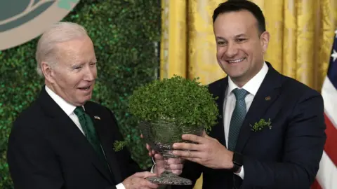 Getty Images Joe Biden and Leo Varadkar exchange a bowl of shamrock